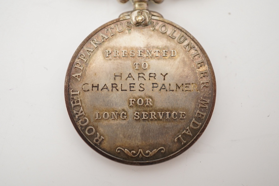 A cased George VI Rocket Apparatus Volunteer Medal Long Service Medal awarded to Harry Charles Palmer. Condition - poor to fair, hinge on the case is broken.